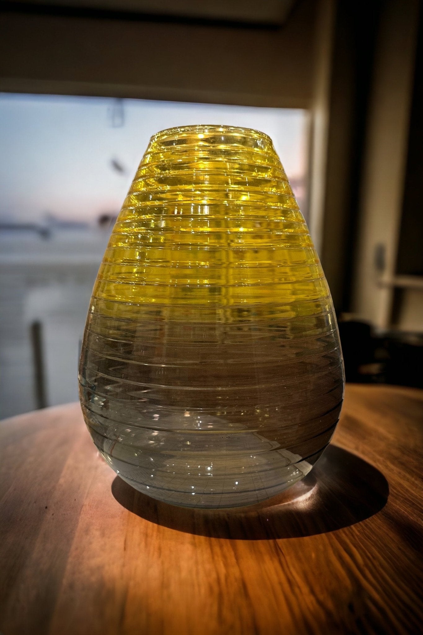 Modern Glass vase with Grading yellow and black colors on wooden table | Les Trois Pyramides