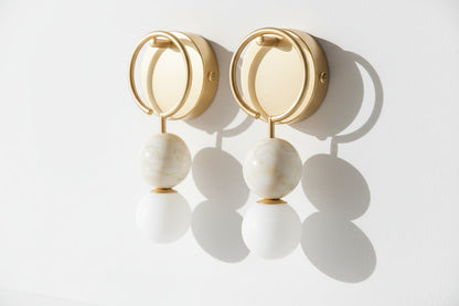 Close-up of natural marble spheres showing veining on wall sconce