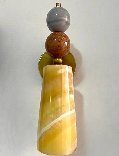 Decorative wall sconce with stone-like beads o