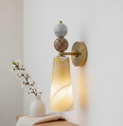 Decorative wall sconce with marble-like finish