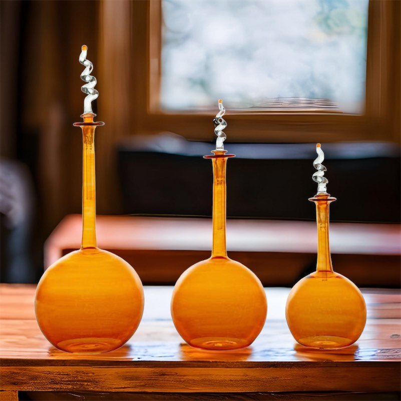 Set of Amber Handcrafted Glass Bottles with Decorative Spiral Stoppers - Les Trois Pyramides