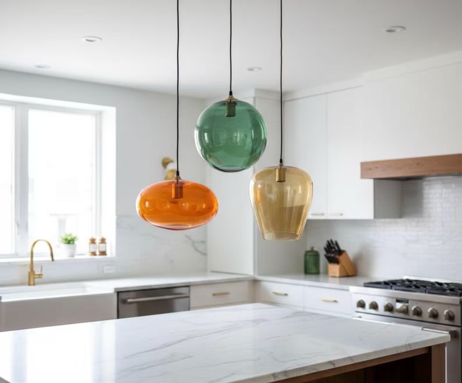 Set of three blown glass light pendants for kitchen decor | Les Trois Pyramides.