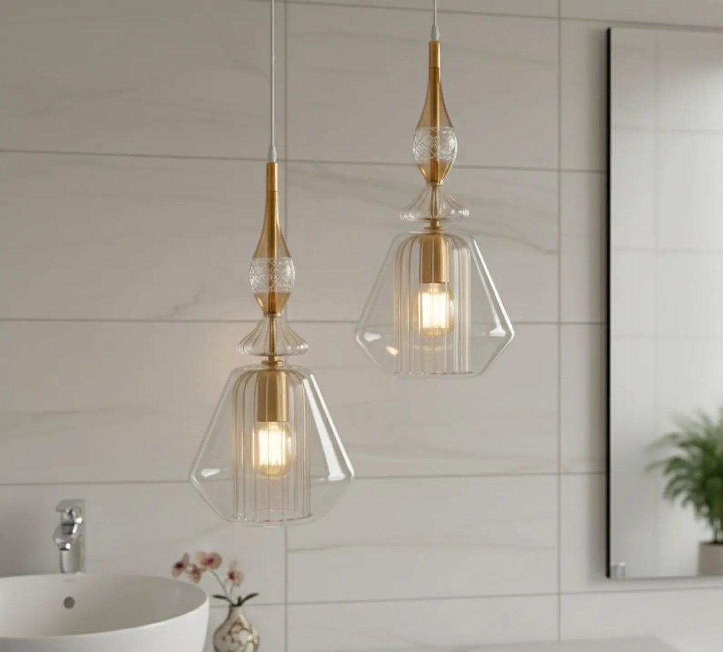Two pendant lights with gold accents hanging in a bathroom.