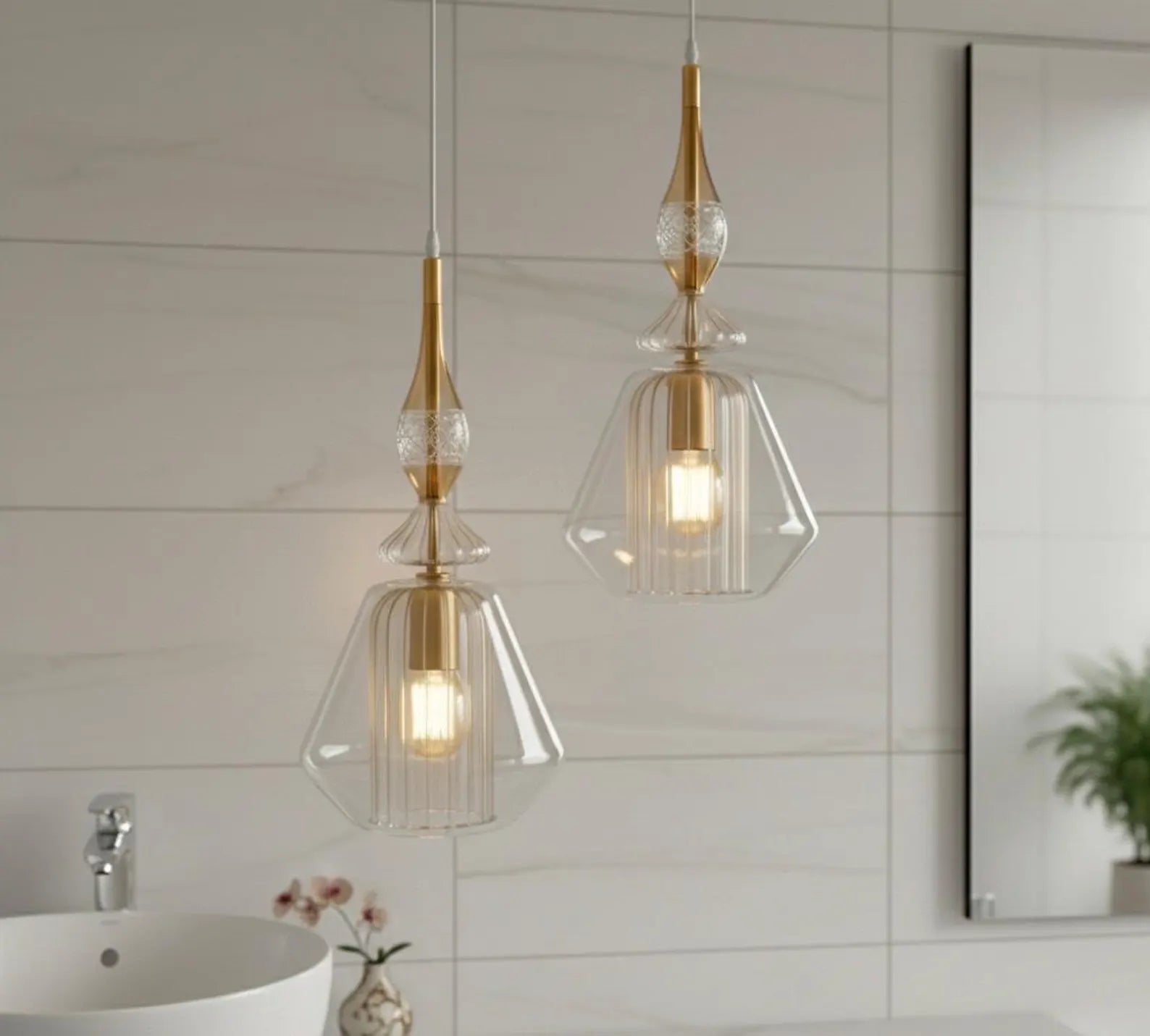 Two pendant lights with gold accents hanging in a bathroom.