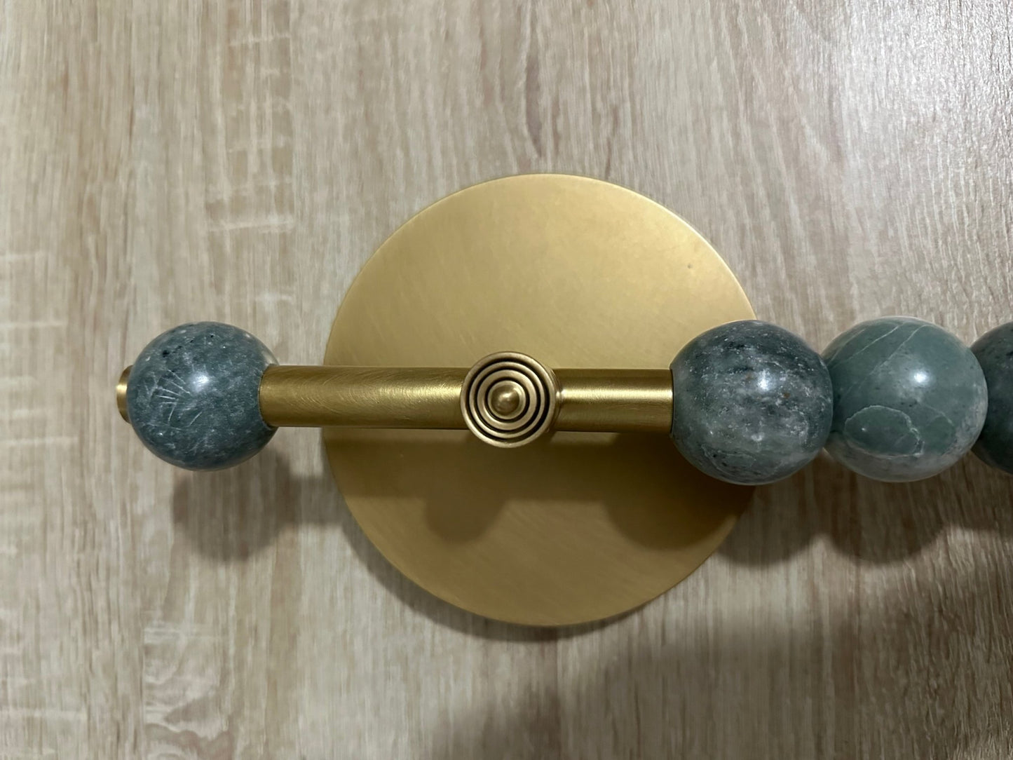 TALISMAN WALL SCONCE (Brass) with Soft Green Gemstones close up