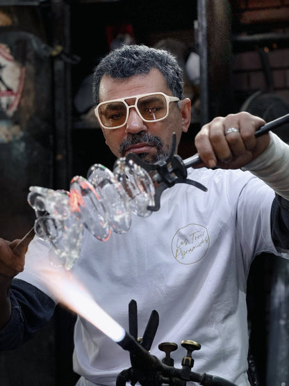 close up for hand-formed clear glass upside down bloom wall light shade