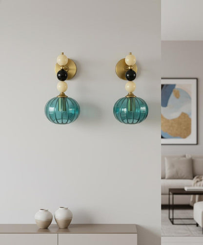 Handmade Ribbed Turquoise Glass Wall Sconce with Natural Marble Stones – Brass Mount Light | Les Trois Pyramides. 