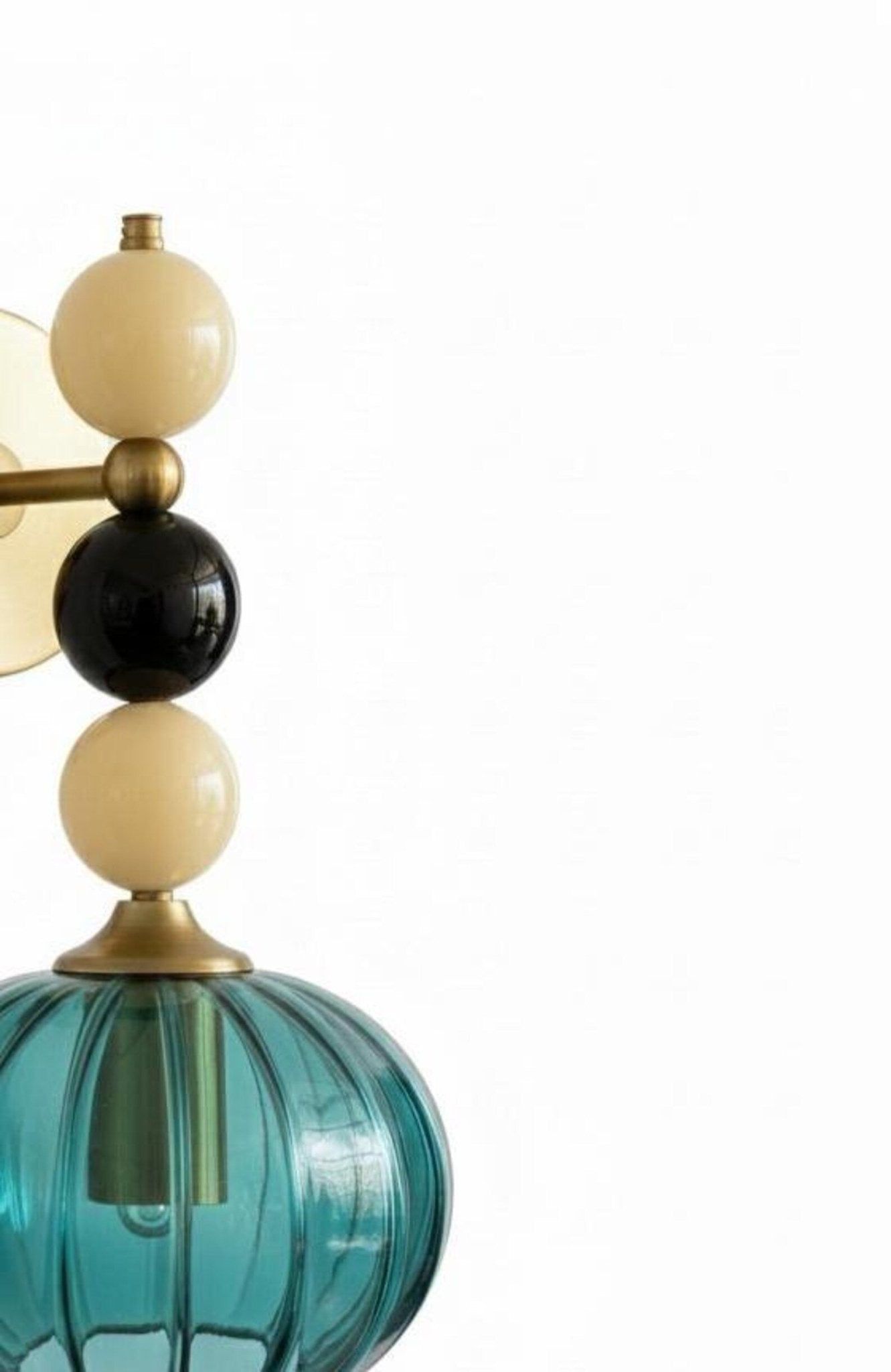 Handmade Ribbed Turquoise Glass Wall Sconce with Natural Marble Stones – Brass Mount Light | Les Trois Pyramides. 