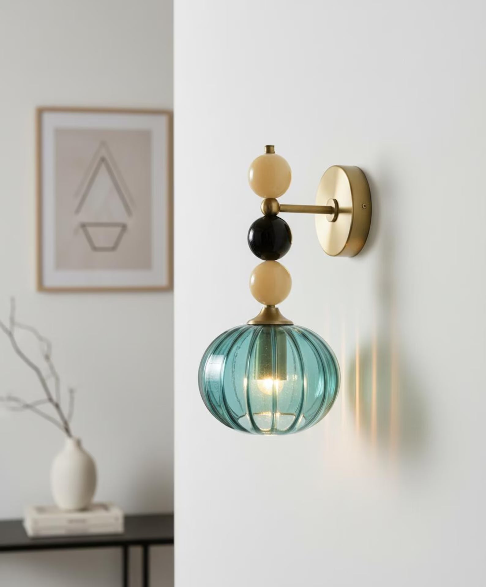 Handmade Ribbed Turquoise Glass Wall Sconce with Natural Marble Stones – Brass Mount Light | Les Trois Pyramides. 