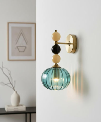 Handmade Ribbed Turquoise Glass Wall Sconce with Natural Marble Stones – Brass Mount Light | Les Trois Pyramides. 