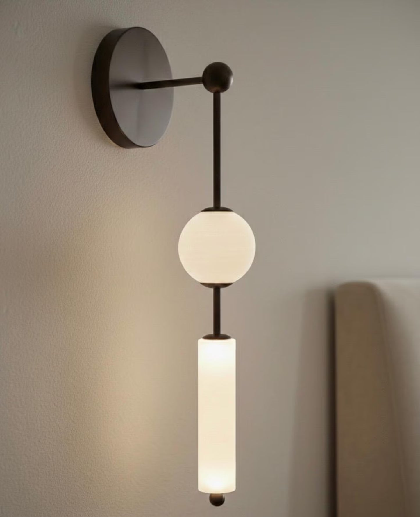 Modern wall sconce with two light bulbs on a neutral background