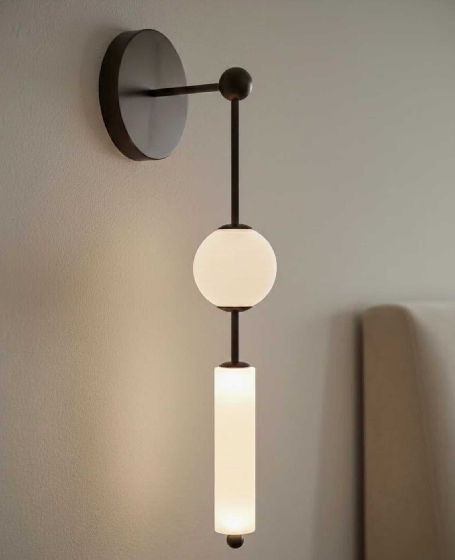 Modern wall sconce with two light bulbs on a neutral background