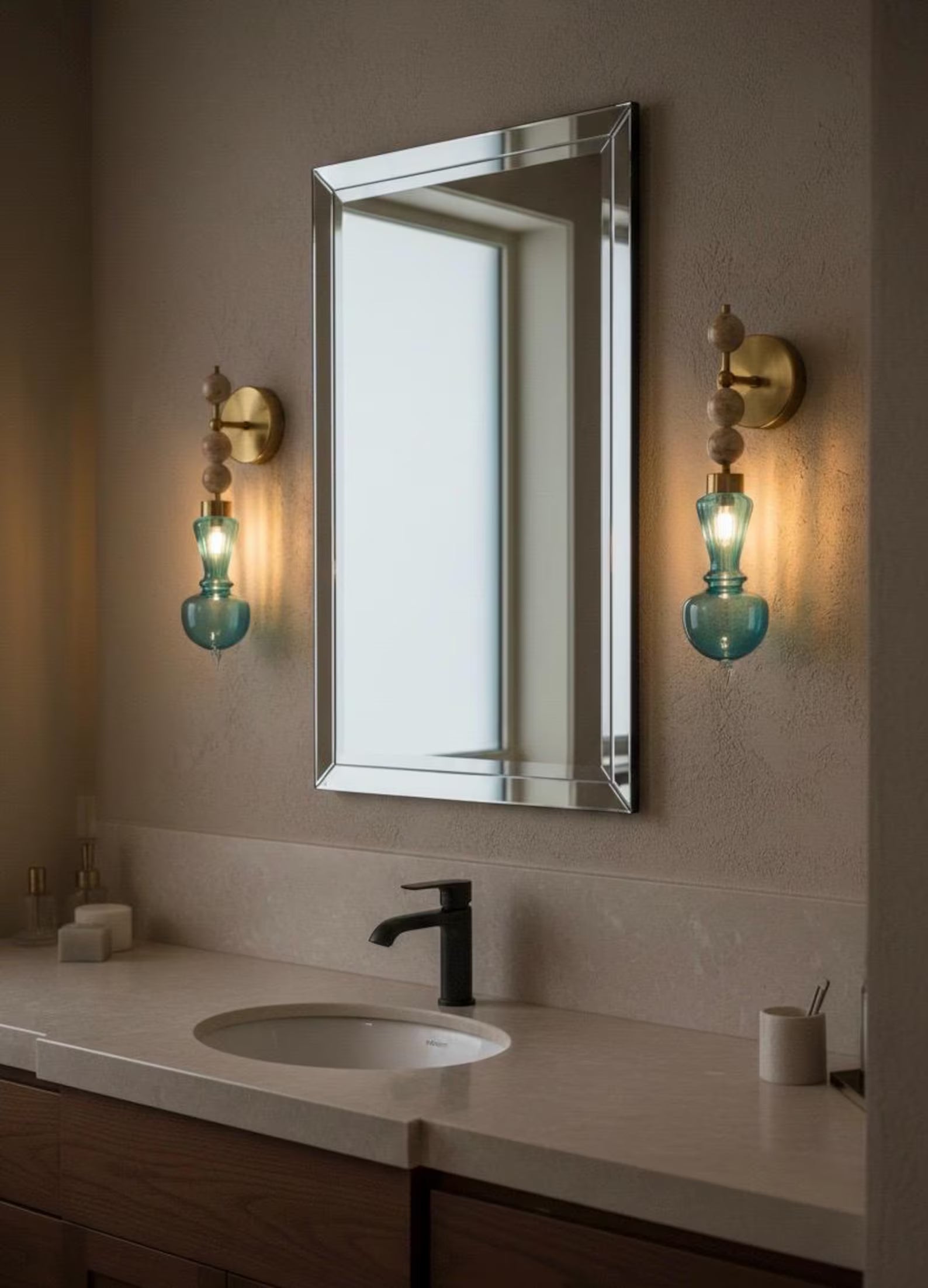 Bathroom vanity with mirror, sink, and decorative wall lights.